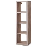 A KALLAX shelving unit in light grey, made of particleboard and paper foil. It stands vertically with multiple open shelves.