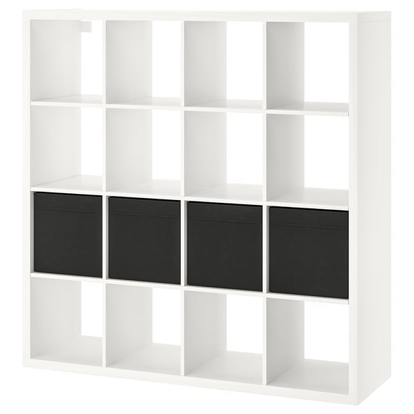 A white KALLAX shelving unit with four dark inserts, square shape, clean design.