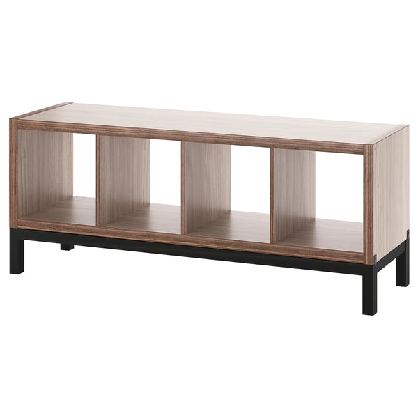 Ikea KALLAX, light grey-brown wood, black metal legs, open shelves, rectangular shape.