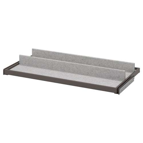 A grey KOMPLEMENT pull-out tray with felt lining for organising items in a wardrobe.