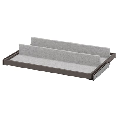 KOMPLEMENT pull-out tray: grey felt, black trim, rectangular, simple design.