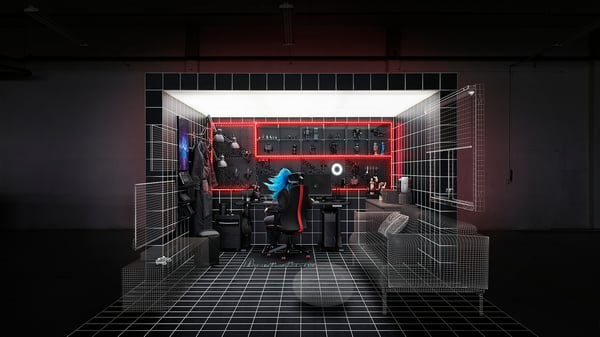 Wireframe gaming setup with desk, chair, monitor, and accessories. Dark background with red accents. 3d rendered design.
