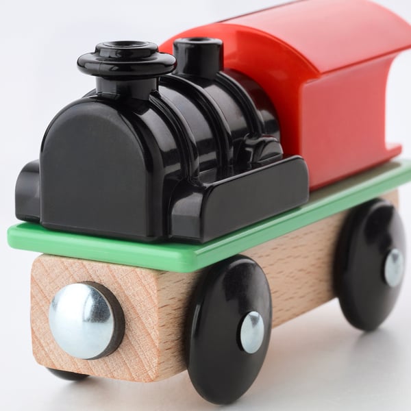 Handsome toy train with shiny black, red, and green details. Sturdy wood & plastic on smooth wheels.