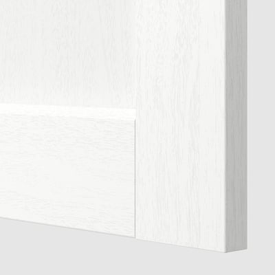 Close-up of METOD cabinets smooth, white wood surface.