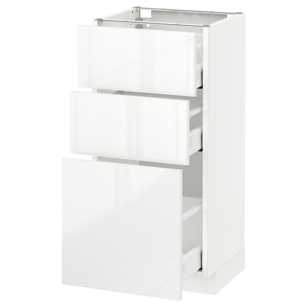 White METOD kitchen cabinet with three glossy drawers.