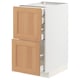 White and oak METOD kitchen cabinet with drawers.