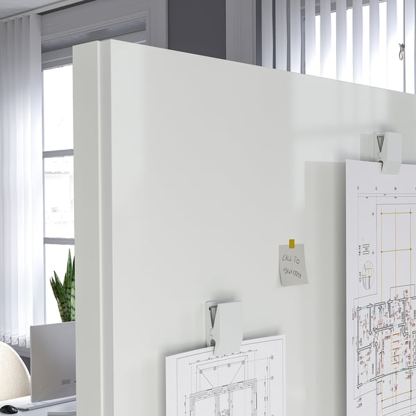 Mobile double-sided whiteboard/noticeboard against window.