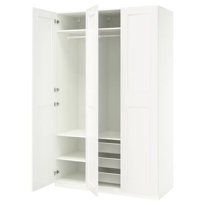 A white IKEA PAX wardrobe with shelves and drawers, featuring a sleek, modern design.