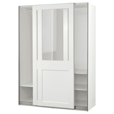 A white PAX wardrobe with glass top doors, sliding doors, and shelves for storage.