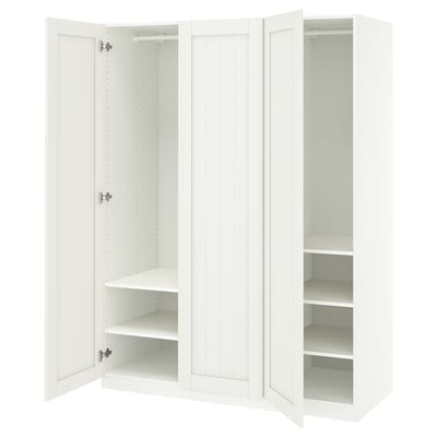 White ikea PAX wardrobe with open doors showcasing shelves, made of fiberboard and particleboard.