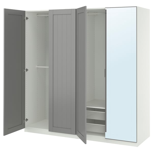 An open grey and white PAX wardrobe with glass and wooden doors, featuring shelves and drawers inside.