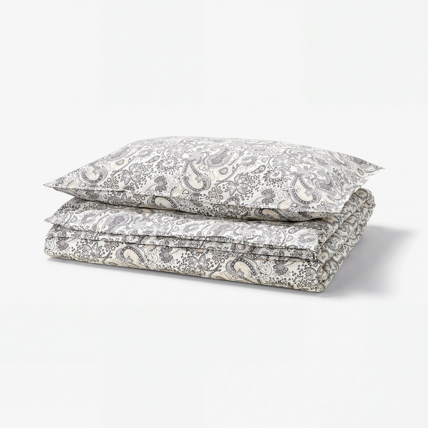 Stack of RODGERSIA paisley bedding - white, cotton-viscose, floral & leaf motifs.