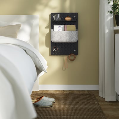 Bedroom with SKÅDIS pegboard, keys, and curtains.