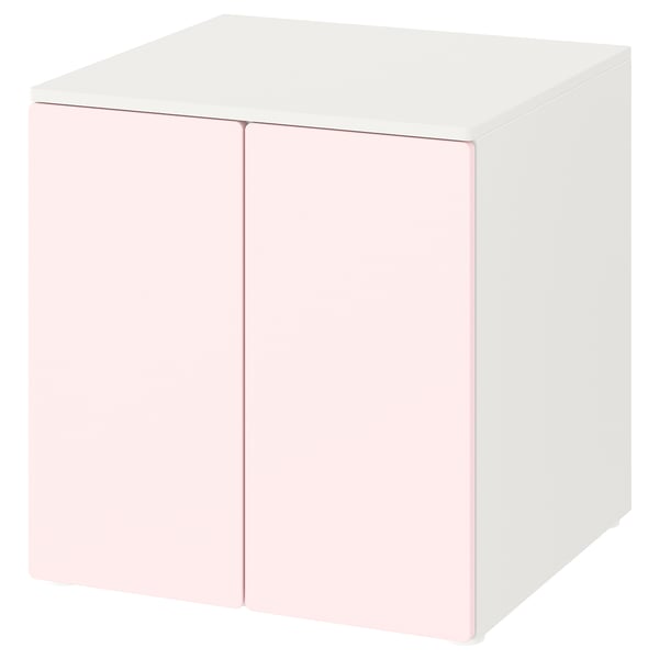 A white and light pink SMÅSTAD cube storage unit with soft-closing doors.