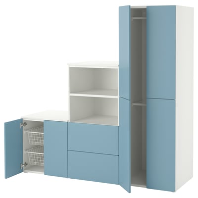 A white and blue ikea SMÅSTAD kids wardrobe with open drawers and doors.