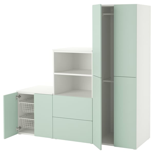 A SMÅSTAD wardrobe in light green, white, and grey, featuring open and closed sections with shelves and drawers.