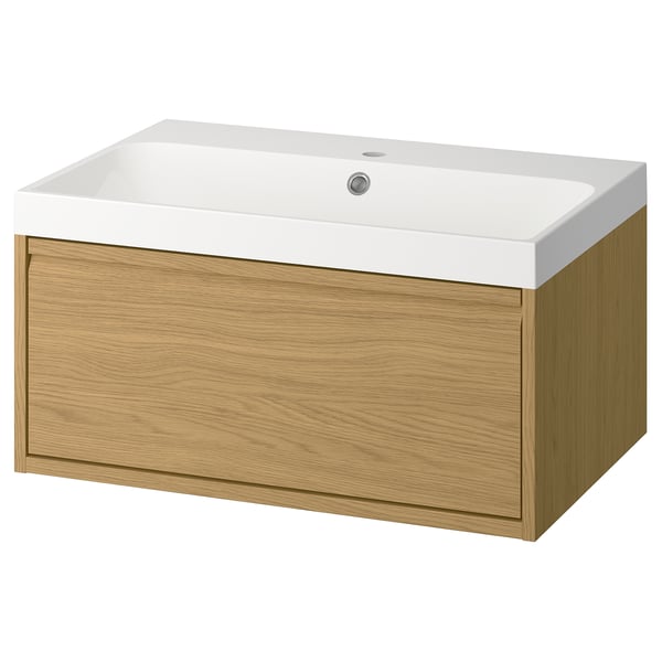 Modern bathroom unit: light oak, white basin, flat design, sleek handles.