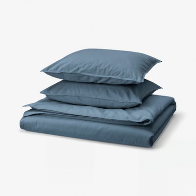 Blue folded bed set, including duvet cover and two pillowcases, featuring soft cotton material.
