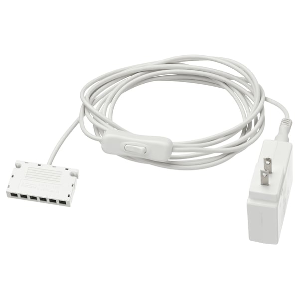 Image ANSLUTA power adapter. Its white, rectangular with cables, designed to control multiple lights with one switch.
