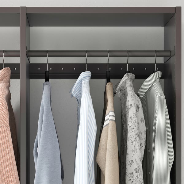 Closet with hanging shirts and sweaters, displaying AURDAL storage system.