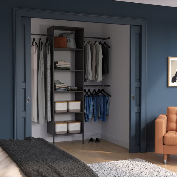 Modern closet: dark blue, AURDAL system with shelves, drawers, railings.