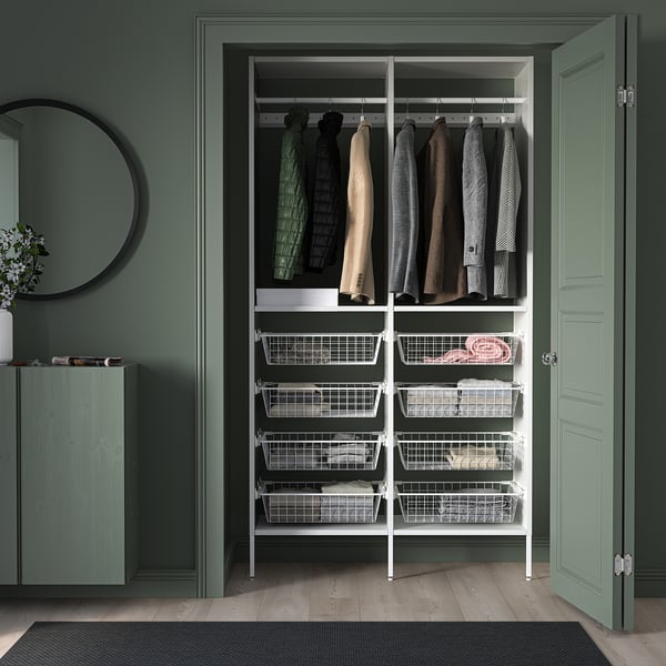 AURDAL white closet storage unit with hangers & drawers, matches green walls & door.