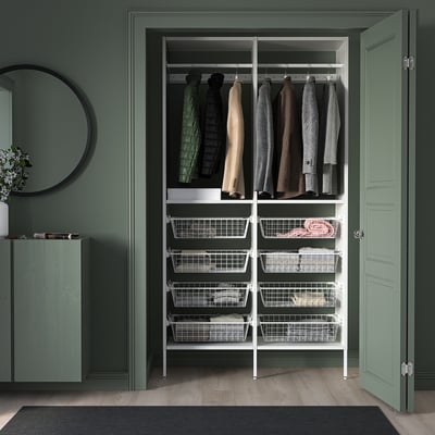 AURDAL white closet storage unit with hangers & drawers, matches green walls & door.