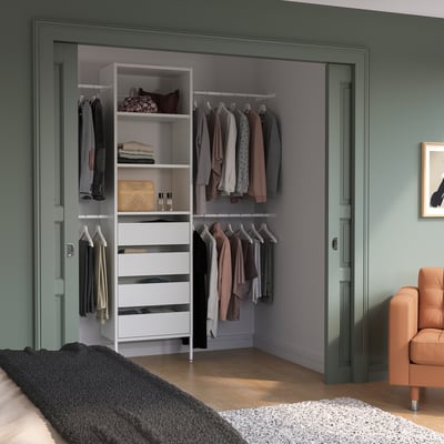 Organised AURDAL storage in closet, white drawers, clothes, cosy atmosphere.