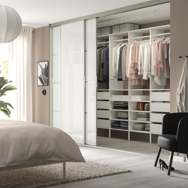 AURDAL grey storage, adjustable, larger than black chair, matches bed.