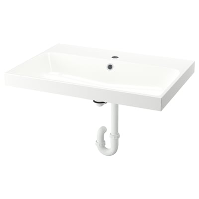 A white BACKSJÖN wall-mounted sink. It is rectangular, sleek, and modern, with a single drain hole. Made from crushed marble, it has a smooth finish.