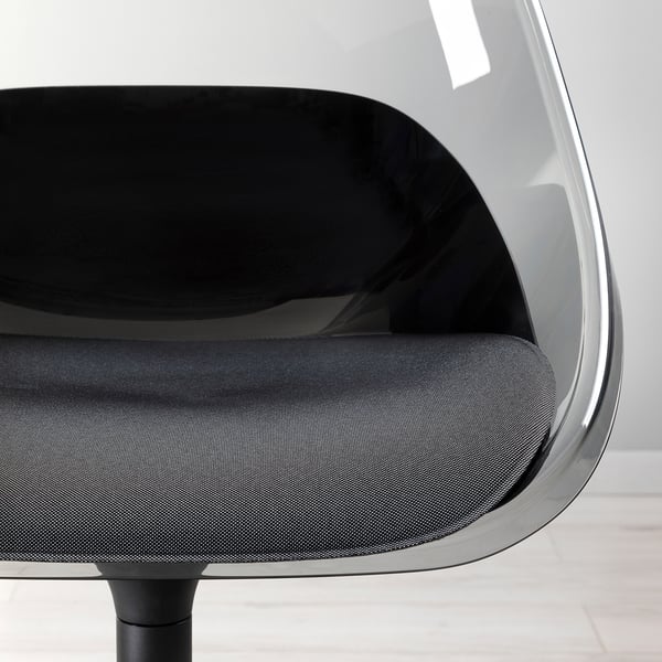 Close-up of a modern, ergonomic chair with a black cushioned seat and a curved, clear backrest.