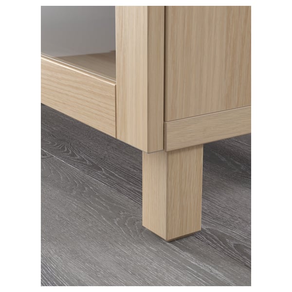 Modern light wood cabinet with metal hinges; sturdy construction, clean design.