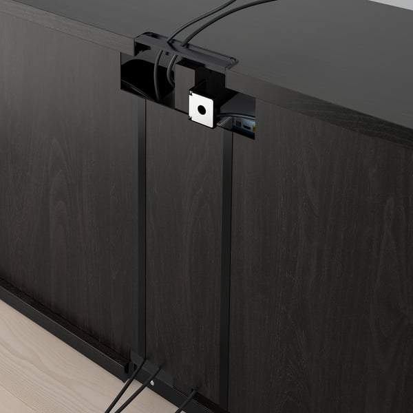 Black tv stand with adjustable feet, cable management, and wall anchors.