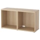 An ikea BESTÅ light beige wooden tv bench with an open shelf.