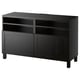 Black BESTÅ tv stand with adjustable shelves and cable management, modern design.