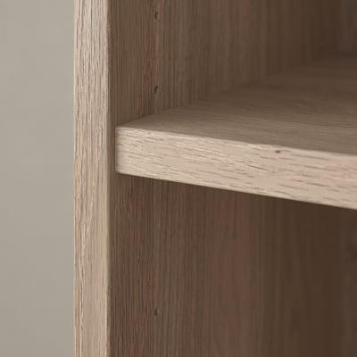 Close-up of a BILLY bookshelfs wooden shelf, showcasing its smooth, sturdy grain and finish.