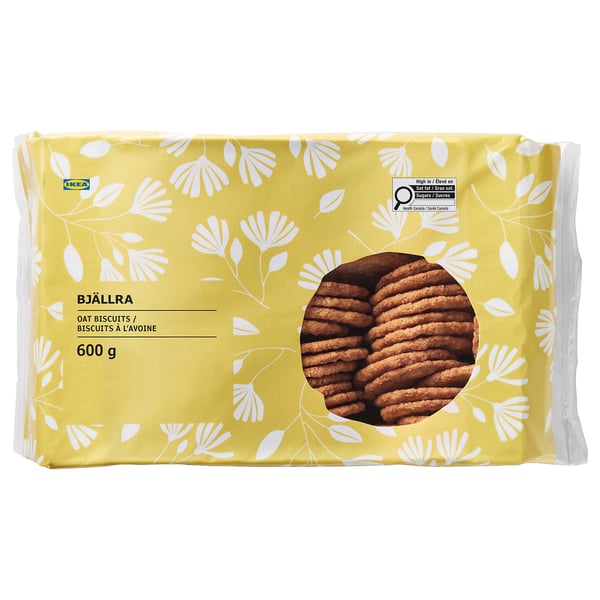 Package of IKEA BJÄLLRA oat biscuits, 600g, with floral design and cookies visible through window.