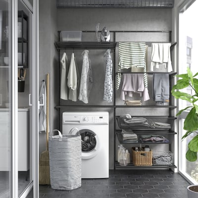 BOAXEL wall storage in laundry area with mesh baskets, drying rack, washing machine.
