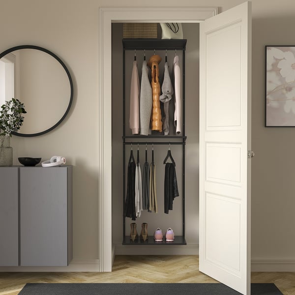 Wall-mounted BOAXEL storage system in dark grey, organising clothes and shoes with open shelves and hanging rods.
