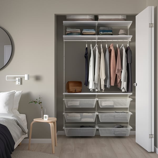 BOAXEL closet with clothes, shelves, and drawers. Compact and well-organized for small rooms.