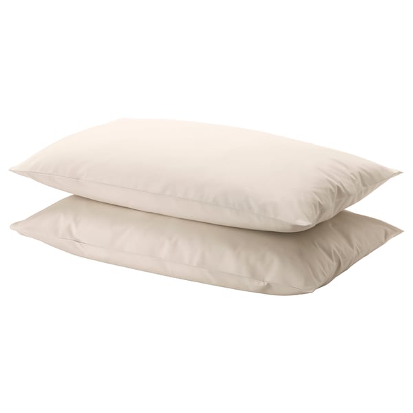 Two light beige DVALA cotton pillows, rectangular, stacked neatly.