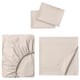 Three beige bed linens: flat sheet, fitted sheet, and pillowcases.