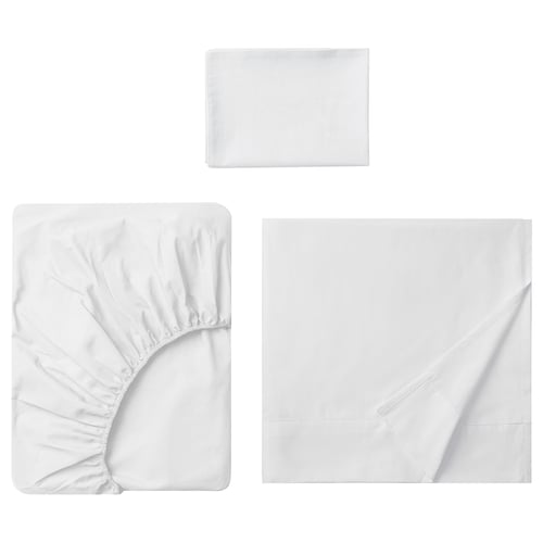 Displays a white DVALA bed linen set, consisting of a flat sheet, a fitted sheet, and a pillowcase, all made of 100% natural cotton.