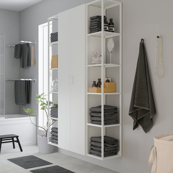 ENHET bathroom shelf unit with 5 shelves, towels, toiletries, hanging hooks.