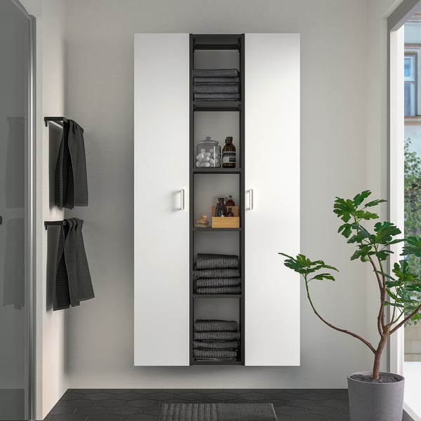 ENHET storage unit with shelves & towels, maximises vertical space.