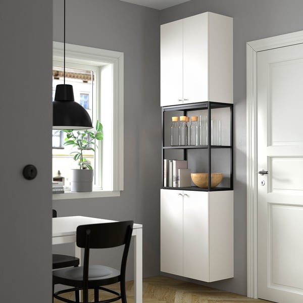 White ENHET storage, sleek & tall, maximises wall space with shelves holding decor.
