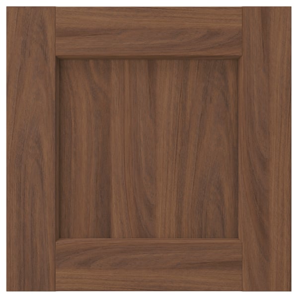 Brown walnut finish cabinet door. Sleek, framed design with subtle grain pattern, smooth surface.