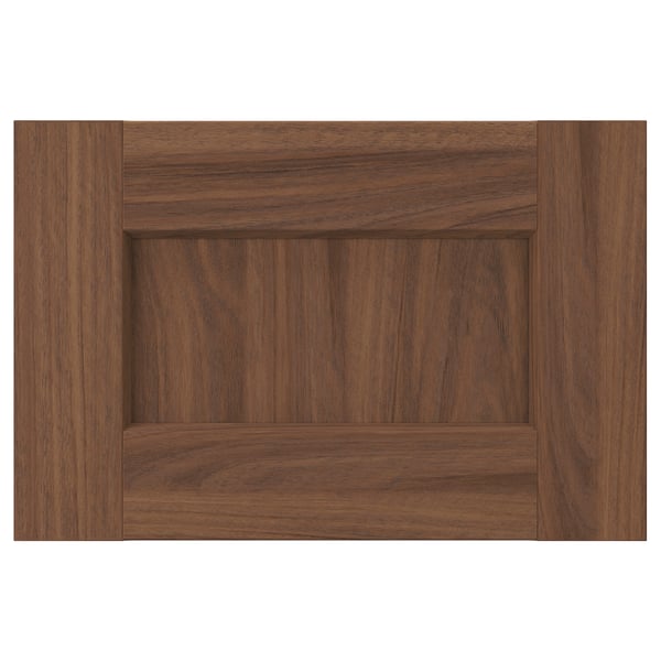 Wooden cabinet door in brown walnut with subtle grain pattern. Square shape and minimalist design.