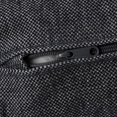 Close-up of high-quality zip on durable, textured fabric.
