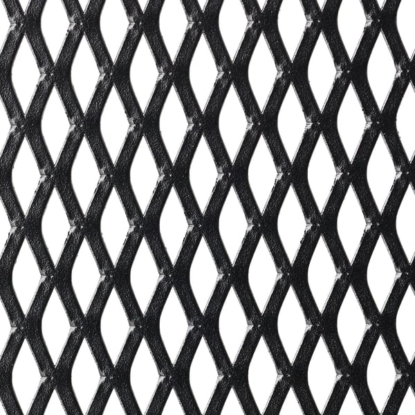 Black metal grate with irregular diamond patterns, showing wear and texture.